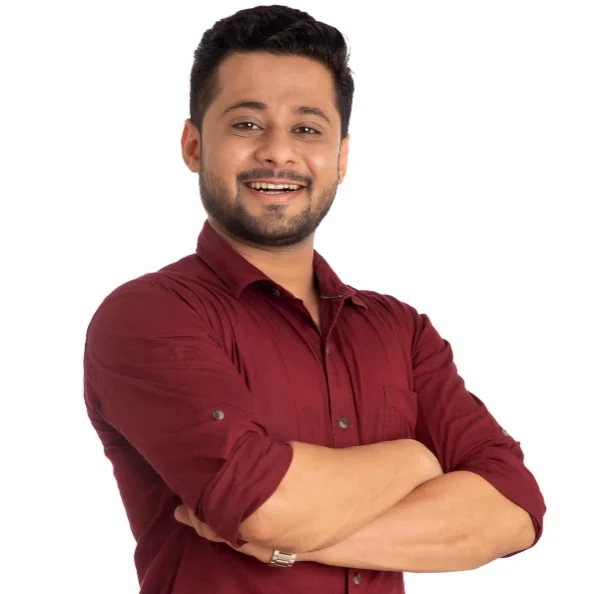 portrait-happy-young-man-posing-with-arms-crossed-hands-folded-white-background